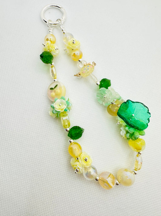 Green and yellow bag charm